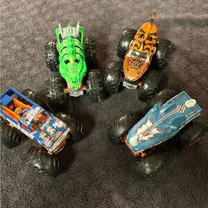 Hot Wheels 4 lot of Monster Truck Toys. Assorted Colors (Green, Orange, Blue)
